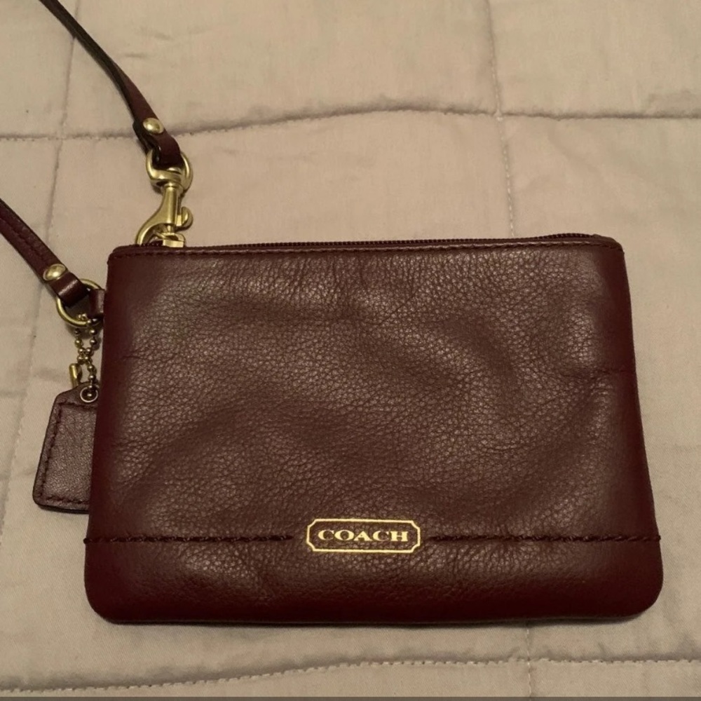 Coach wristlet in eggplant